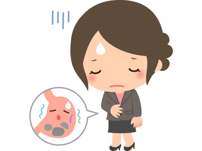 胃もたれで調子が悪い女性