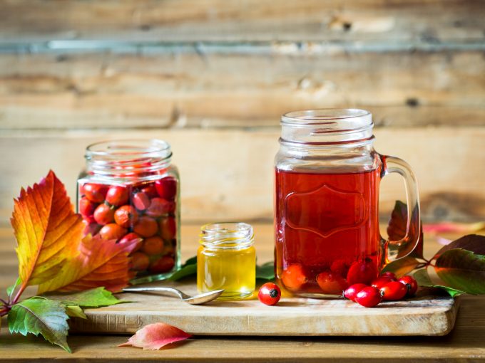 Rosehip tea and berries with honey
